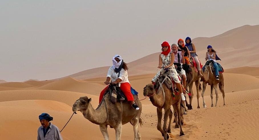 Our small group Morocco tours include guided camel treks through the iconic golden dunes of Erg Chebbi.